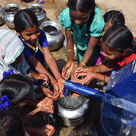 Indian children getting clean water