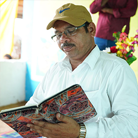 Indian man reading Bible